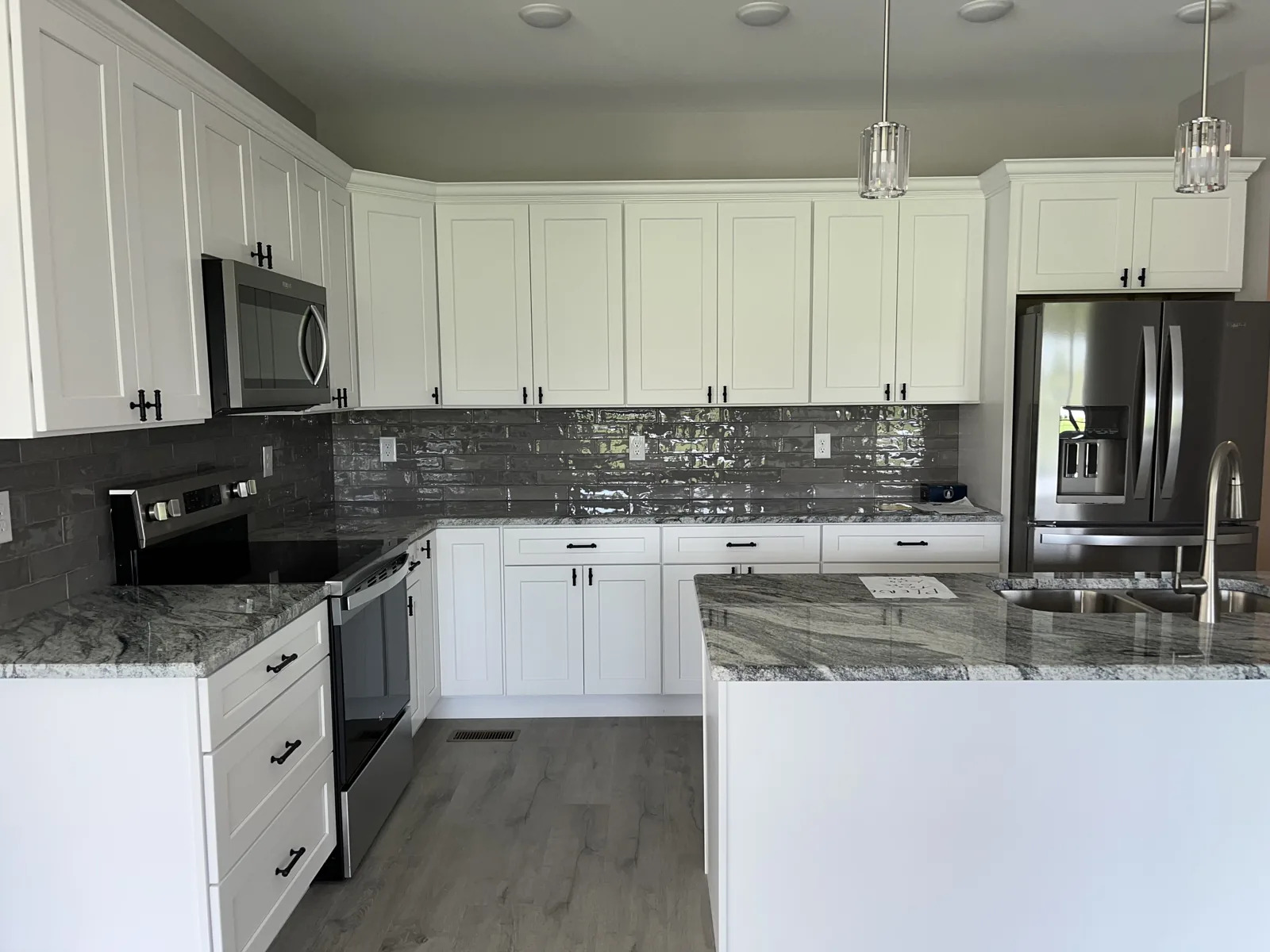 Kitchen island and breakfast bar with granite countertops at Old Silo Hill #2